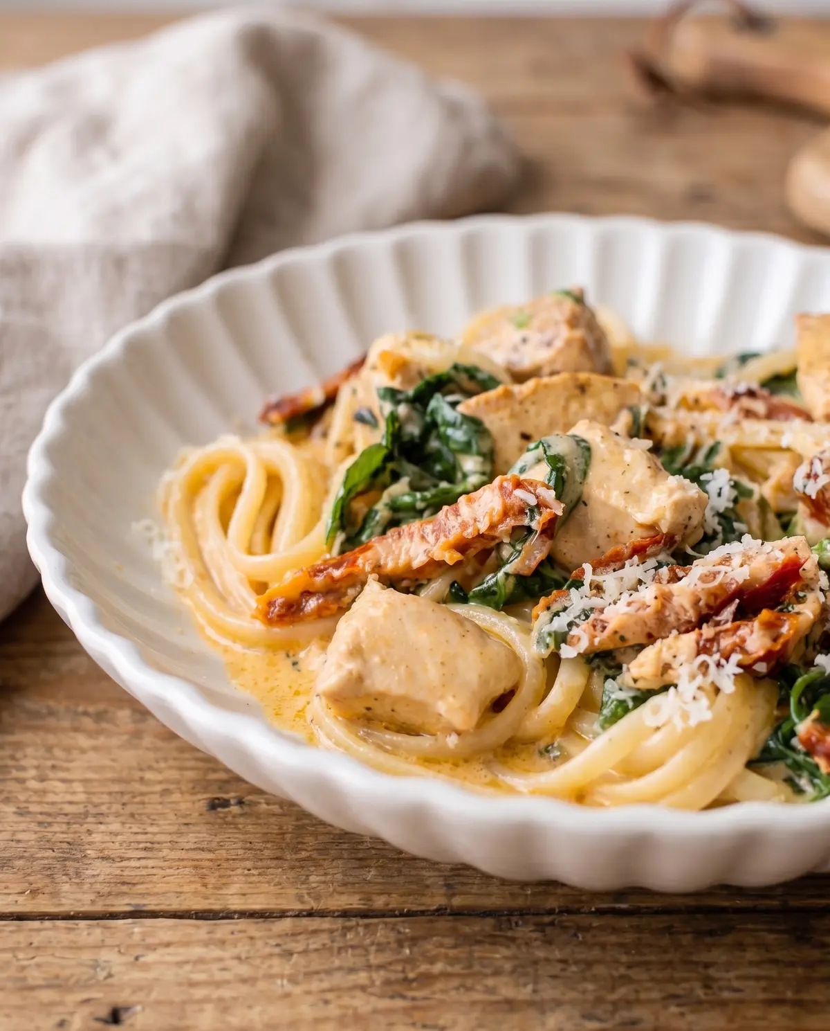Creamy Tuscan Chicken Pasta from a low angle
