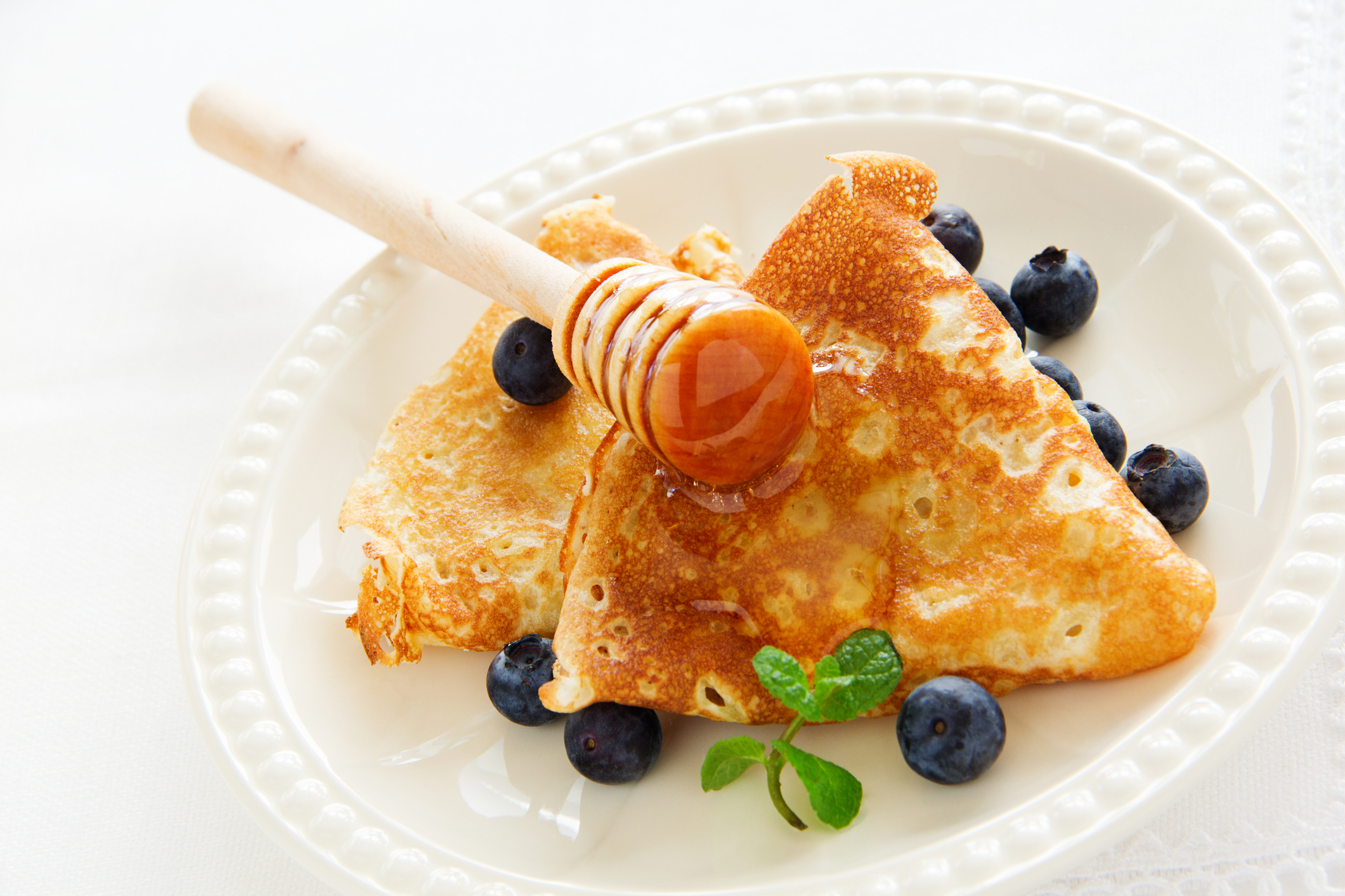Fluffy Pancakes with Mixed Berries and Honey