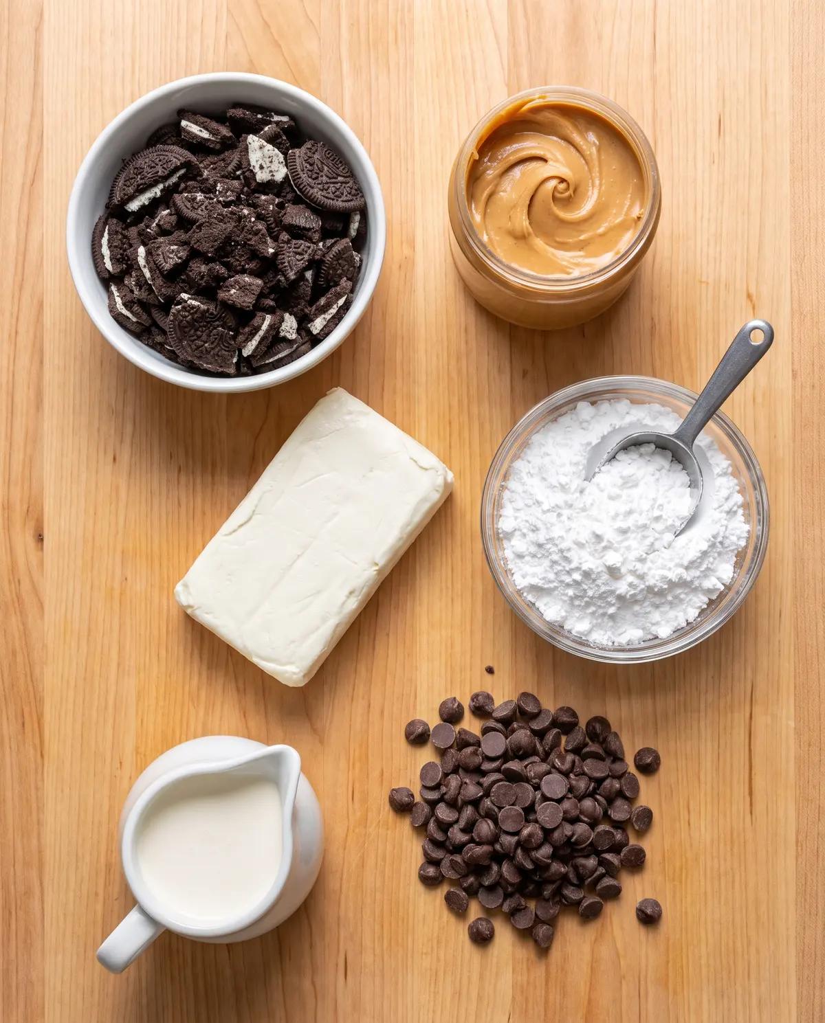 Chocolate peanut butter pie ingredients on wood surface