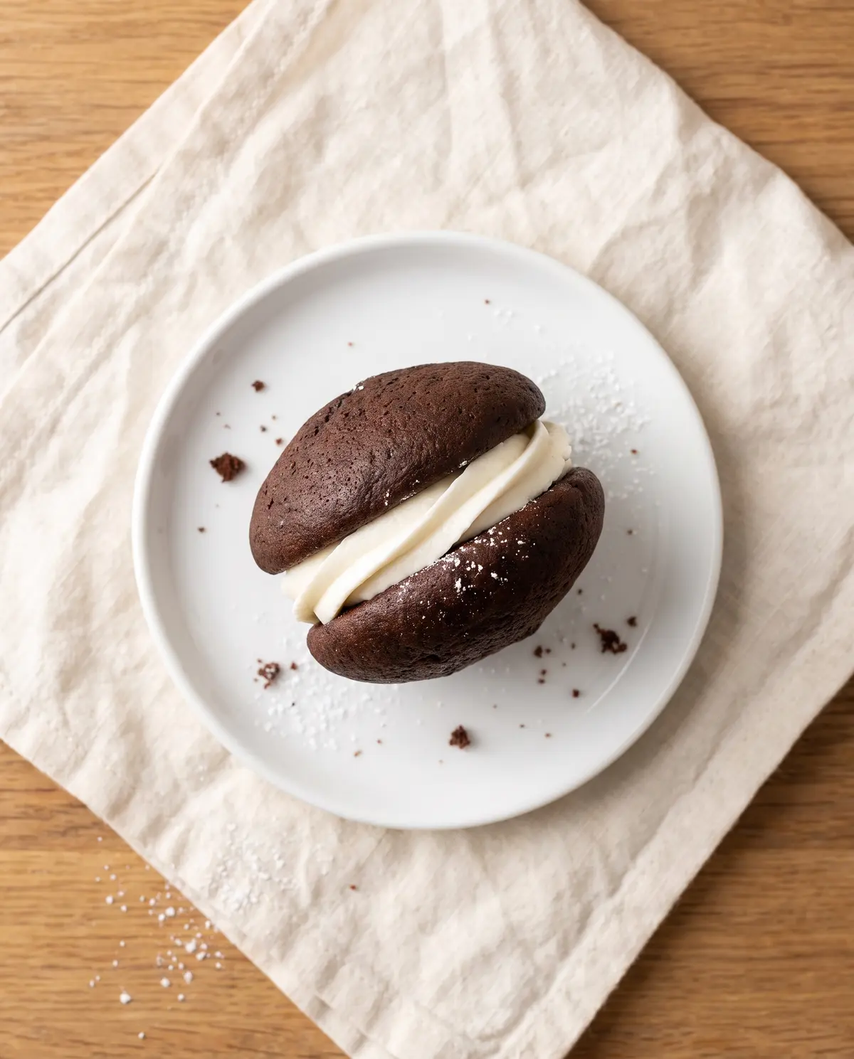 A single chocolate whoopie pie viewed from above