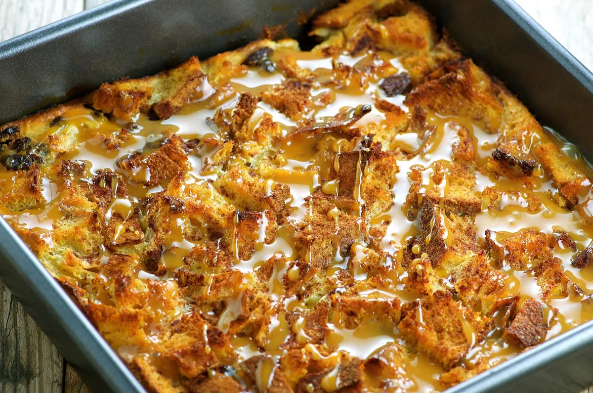 Bread Pudding With Chocolate Chips and Warm Praline Sauce